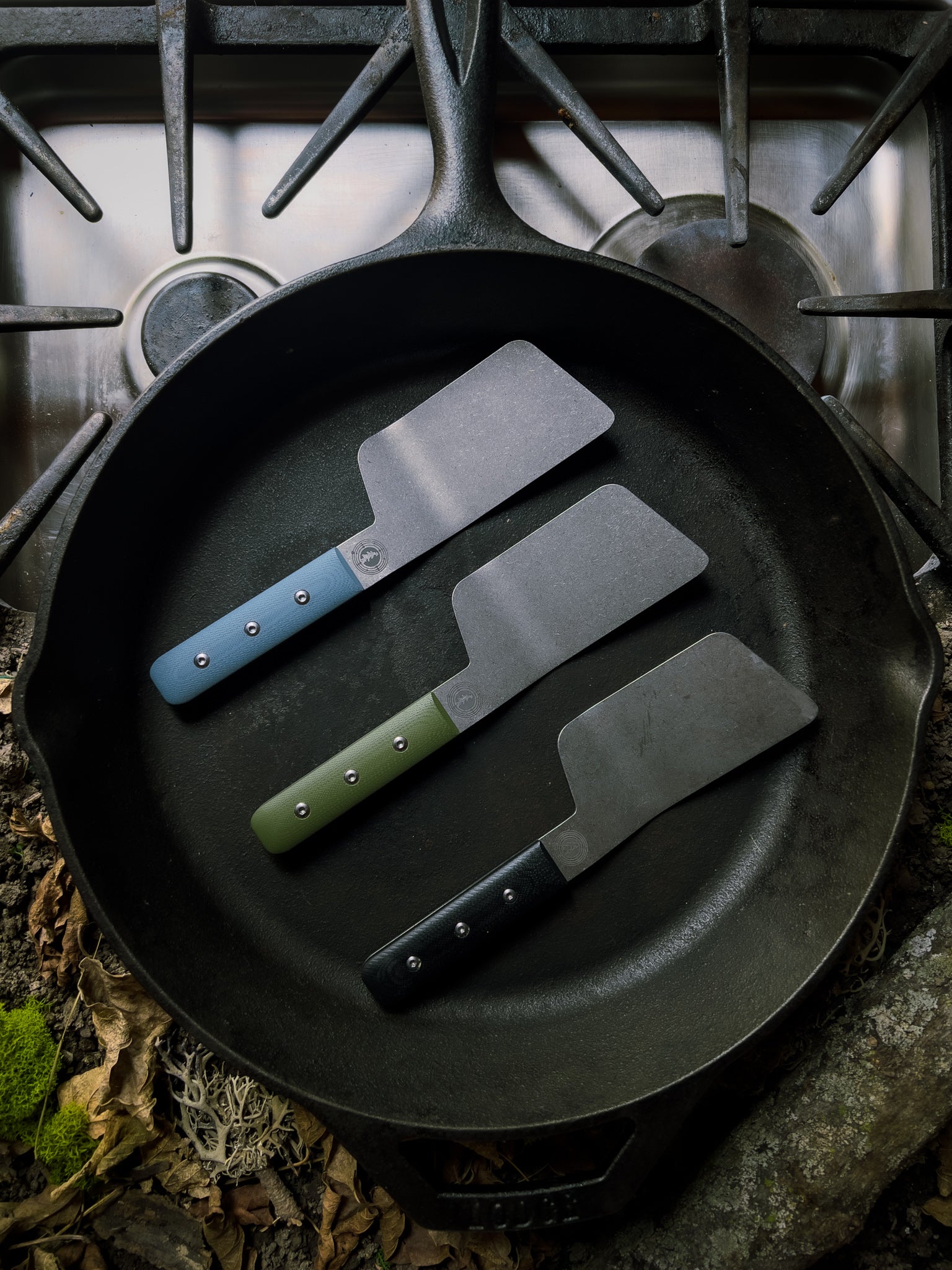 variations of mini spatulas sitting in a skillet